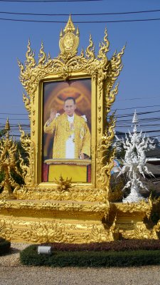 Large pictures of the king line every major road in Thailand.  He's very popular.  This one is near the White Temple.