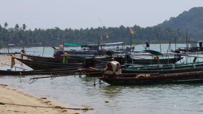 The long tails of these fishing boats are the drive shafts of car engines used as boat motors.
