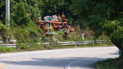 A collection of spirit houses at the Kho Samui equivalent of Deadman's Curve.