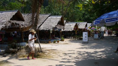 Then, through this row of massage huts and beach bars.