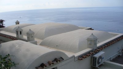 Many buildings in Positano have covered domes of sand on their roofs as insulation.