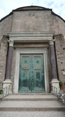 An ancient bronze door still on its original hinges.