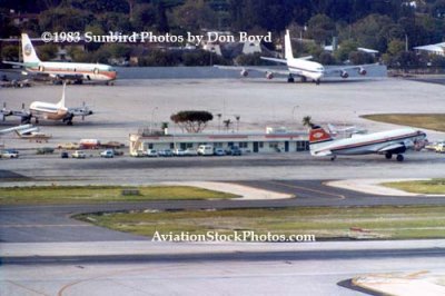 1983 - the old General Aviation Center with a C-46 in the front and a Belize Airways B720 and a Pan Aviation B707 in the back