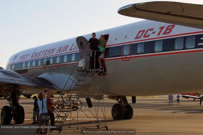 2010 - Carlos Gomez boarding the restored Eastern Air Lines DC-7B N836D for the flight to Oshkosh aviation stock photo #1257