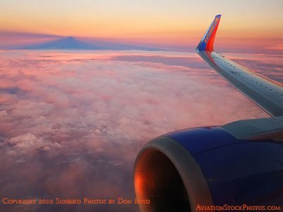 Sunset providing nice colors on the clouds onboard Southwest flight 2380 FLL to BNA aviation sunset stock photo #3787