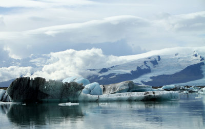 Volcanic ash covered iceberg