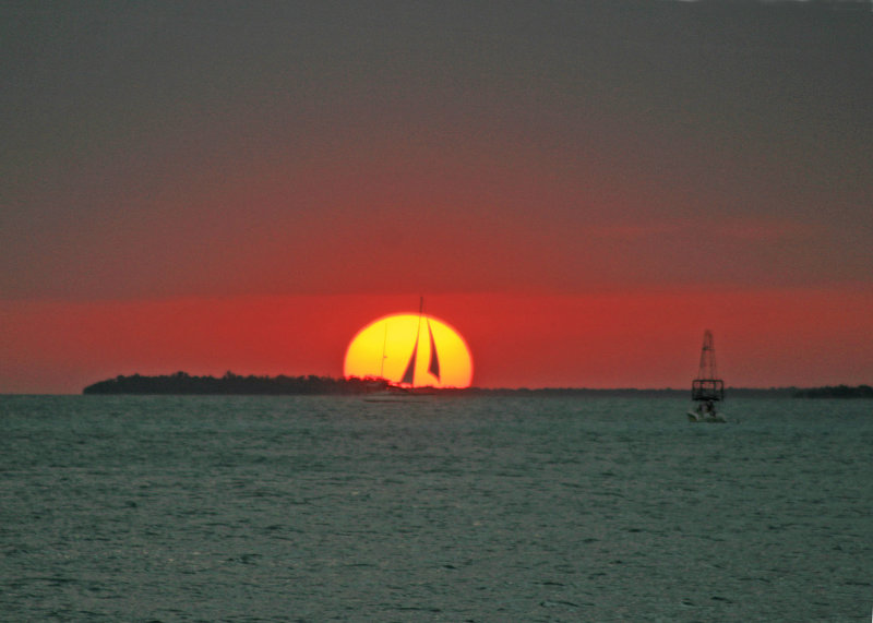 My sunset pictures were only so-so until a sailboat came by.