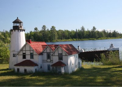 On the road to Pt. Iroquois in Brimley, I found this roadside model of a freighter passing the lighthouse