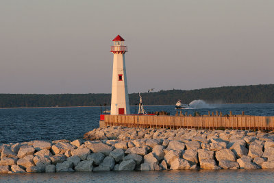 St. Ignace has a fake lighthouse. I enjoyed photographing cars, ferries, and parasailors from this pier one morning.
