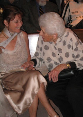 Janet talks to Sandra at her wedding