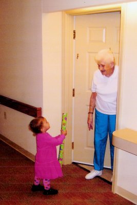 Janet receives a young visitor (Julie) at her apartment in Calvert Landing.