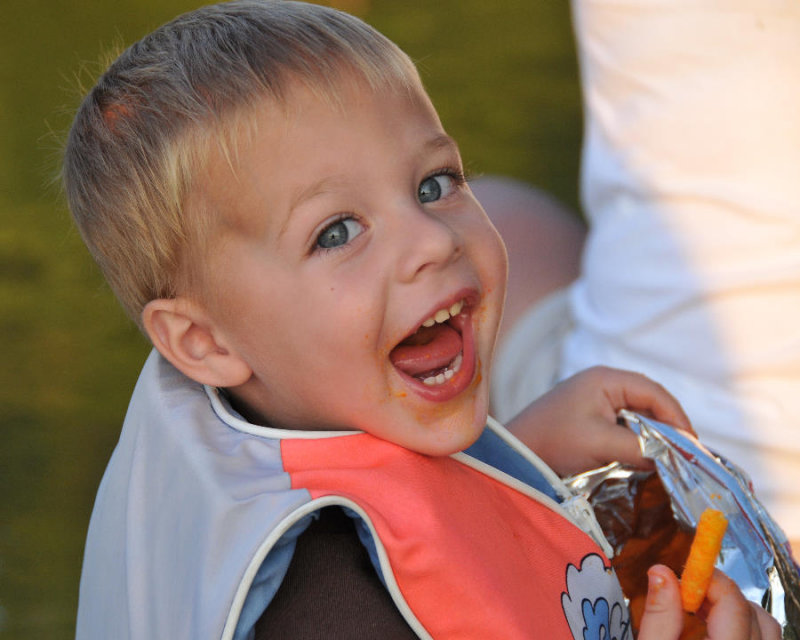 Camden enjoying his Cheetos on the canoe