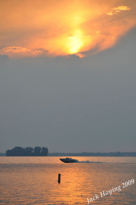 Boater on Grand Lake at sunset