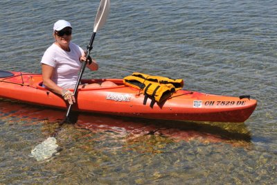 Brenda kayaking on the clear waters of Lake Couchiching