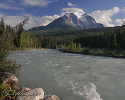 The Bow River near Lake Louise. A glacier is on the mountain in the background