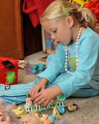 Macey Playing with the Ponies