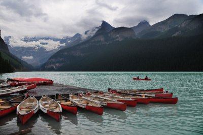 Canoes on overcast Lake Louise