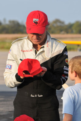 Sean D. Tucker signs an autograph for a young fan