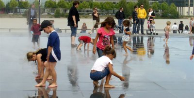 Children playing in the water mirror
