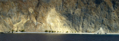 A stretch of sandy beach, accessible by boat only