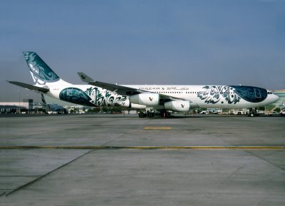 This is the Caligraphy special scheme applied to the Gulf Air A-340, 
seen at Dubai in MAY 2002 during a weather (fog) diversion from Abu-Dhabi in the early hours.
The livery ended and went to Gulf Air new colours in 2007.