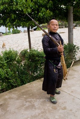 Baisha Miao  man with gun