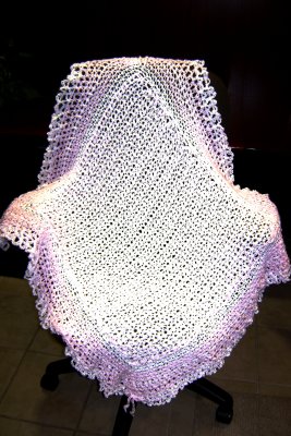 This is Emmie's personally-designed blanket.  Different yarn and a fancier style.  (I hope she likes it!)