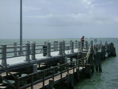 When I downloaded all my trip's pictures on my computer and saw them in large-size, I first thought I'd taken this shot of the man for some reason.  After looking at it a few seconds, I realized it wasn't him that caught my attention that day, but the seagulls perched on top of the pier's posts! Again, another picture I took to try and capture the birds in it.