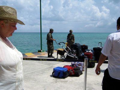 Drug sniffing dogs take on a baby carriage - Playa del Carmen ferry