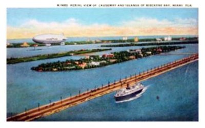 1932 - the Goodyear Blimp flying over County Causeway, Miami