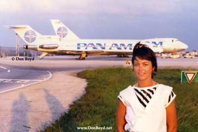A young European lady with Pan Am aircraft in the background at Miami International Airport