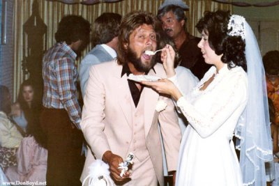 Susan feeding Terry some delicious wedding cake