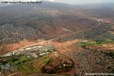 A view of Makakio City (upper left) and the Kapolei golf course from Northwest Airlines flight 803 B747-451 N670US