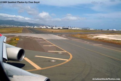 View from the upper deck of Northwest Airlines flight 802 B747-451 N664US of Honolulu International Airport