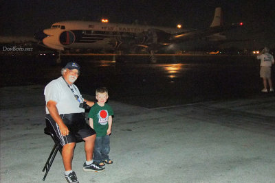 Eddy Gual with my grandson Kyler and the restored Eastern Air Lines DC-7B N836D
