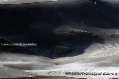 2007 - five people climbing the dunes at Great Sand Dunes National Park after a thunderstorm with hail