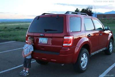 August 2010 - Kyler and our rental vehicle after spotting airplanes for me to photograph
