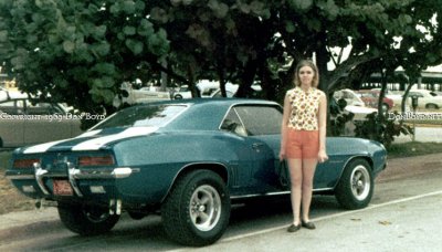 1969 - nice Camaro parked on Ocean Drive with the Miami Beach Kennel Club two-story parking garage in the right background