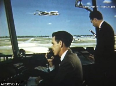 1953 - FAA Air Traffic Controller Don Innes and another gent at MIA's Tower #8 with Eastern Constellation in the background