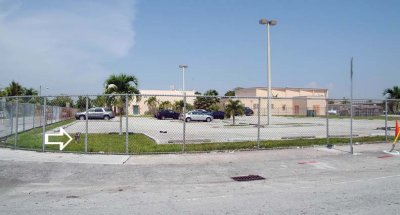 The pathetic looking W. 10th Avenue parking lot at Palm Springs Middle School (#1955) - comments below:
