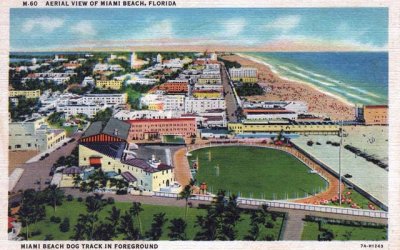 Late 1930's - aerial view of Miami Beach with the Miami Beach dog track in foreground