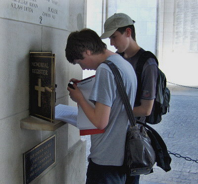 YOUTHS BROWSE THE MEMORIAL REGISTER