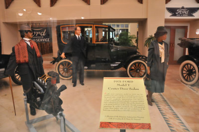 1921 Ford Model T Center Door Sedan (photographed through showroom window)