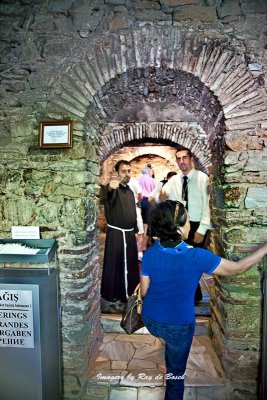 No photos allowed, says the priest, while waving his hand!