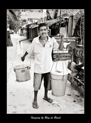 a taho vendor carrying a heavy load