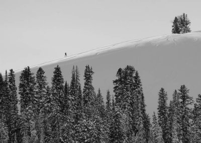 Lone skiier skinning up, Teton Pass