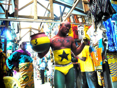 a Ghana supporter at an Accra market