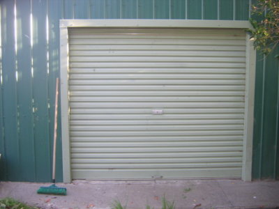 24 september Green garage door with green broom