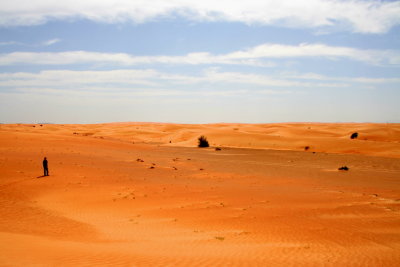 A lone wanderer in the desert of Dubai (UAE)