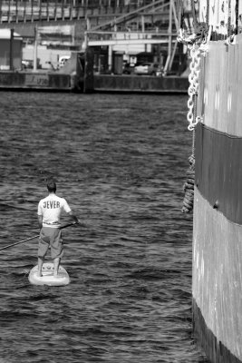 Paddler in the harbour (Kiel, Germany)